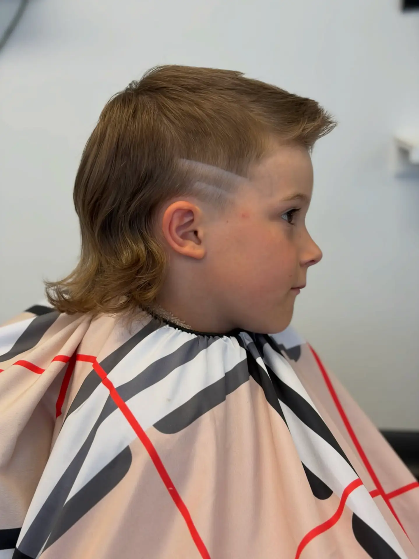 Kids' cut with modern mullet and shaved-line detail